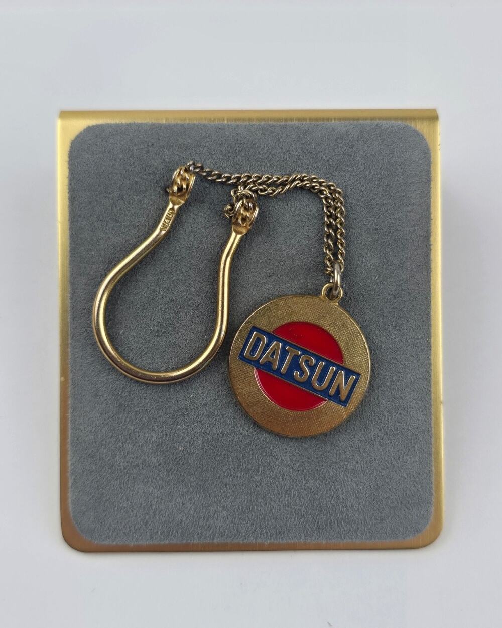 Vintage Datsun Automobile keychain fob gold tone red & blue enamel